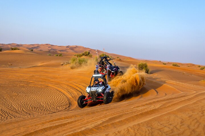 Experience the freedom of the desert as you navigate stunning dunes in a powerful 4x4 buggy creating unforgettable memories in Dubai's breathtaking landscape.